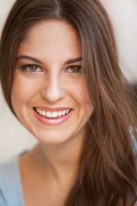 a smiling woman after her bone grafts for regeneration